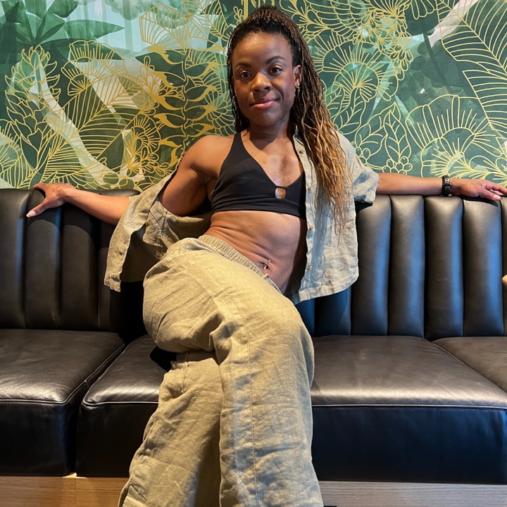 Michelle in her 30s, sitting on a couch